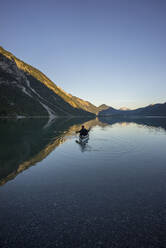 Canoe on Lake Plansee in the evening, Tyrol, Austria - MALF00097