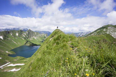 Hiker on viewpoint, Lake Schrecksee, Bavaria, Germany - MALF00106