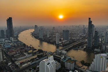 Thailand, Bangkok, Aerial view of capital city downtown at sunset - RUNF04064