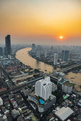 Thailand, Bangkok, Aerial view of capital city downtown at sunset - RUNF04065
