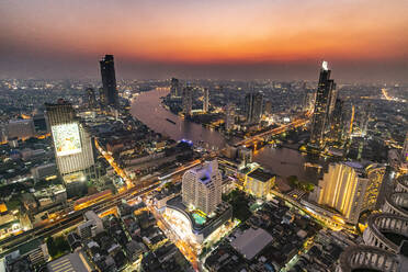 Thailand, Bangkok, Aerial view of capital city downtown at sunset - RUNF04068