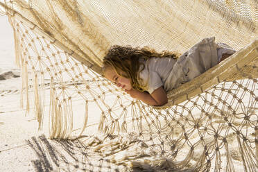 3 year old girl resting in hammock, Cabo San Lucas, Mexico - MINF15109