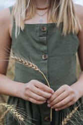 Girl's hands with wheat ear - EYAF01263