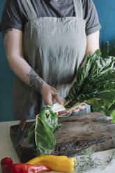 Young woman preparing pak choi - ALBF01353