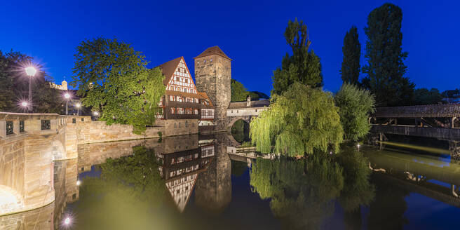 Germany, Bavaria, Nuremberg, Panorama of river Pegnitz, Weinstadel and Wasserturm at night - WDF06217