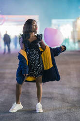 Cheerful African American woman with cotton candy - ADSF12294