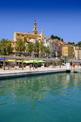 France, Provence-Alpes-Cote dAzur, Menton, Coastal promenade with Basilica of Saint-Michel-Archange in background - LBF03182