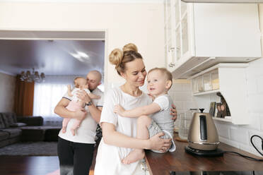 Happy family in kitchen - EYAF01293