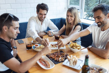 Friends having meal in restaurant - JSRF01114