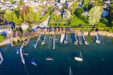 Germany, Bavaria, Tutzing, Sailboats in front of boathouses on shore of Lake Starnberg - SIEF10014