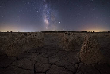 Majestic scenery of volcanic terrain with porous rocks and colorful Milky Way on background - ADSF12755