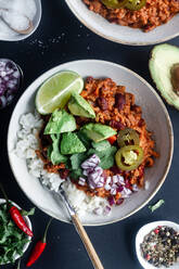 Served chili with rice and vegetables on table - ADSF13119