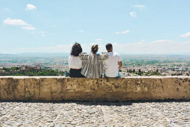 Group of friends doing tourism in Spain and contemplating the panoramic views of the Alhambra in Granada - ADSF13436