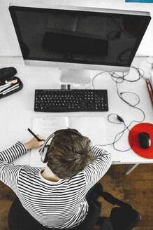 Boy doing homework on desk - MMFF01290