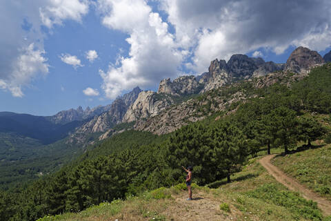 Female hiker in Aiguilles de Bavella massif stock photo