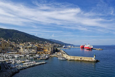 France, Haute-Corse, Bastia, Harbor of coastal town with cruise ship in background - UMF01003