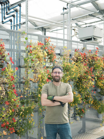 Portrait of a confident man in a greenhouse stock photo