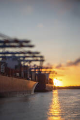 Germany, Hamburg, Port of Hamburg at sunset - ASCF01448