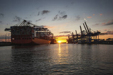 Germany, Hamburg, Port of Hamburg at sunset - ASCF01449