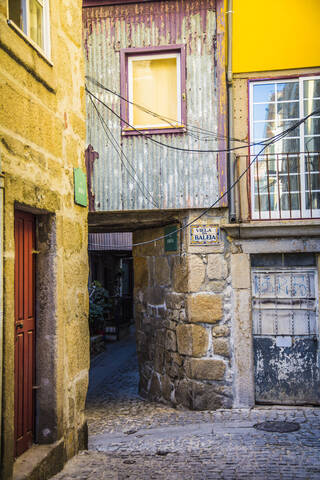 Portugal, Porto District, Porto, Cobblestone alley between old houses stock photo