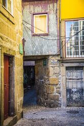 Portugal, Porto District, Porto, Cobblestone alley between old houses - NGF00647