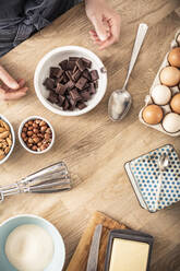 Woman hand arranging ingredient for baking cake at home - MSUF00298