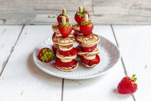 Plate of mini pancakes with strawberries and bananas - SARF04616