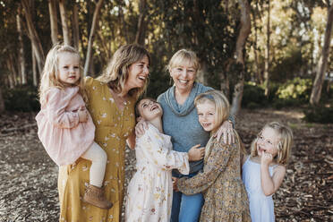 Portrait of Multigenerational Family of Women Embracing Outside - CAVF88616