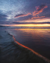 Spain, Province of A Coruna, Valdovino, Campelo Beach at dramatic sunset - RAEF02415