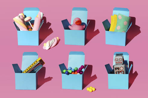 Pattern of boxes with various gifts consisting of harmonica, plastic spheres, vintage robot toy, sweets, rubber duck and pair of socks - GEMF04105