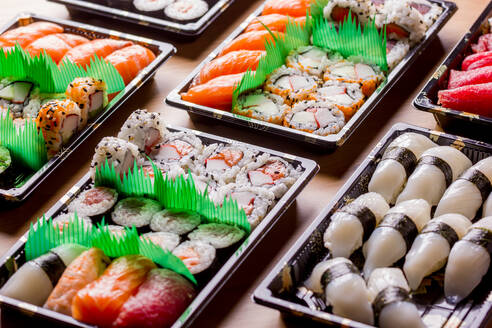 Appetizing delicious colorful sushi served table in restaurant - ADSF14203