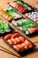 Appetizing delicious colorful sushi served table in restaurant - ADSF14204