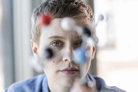 Portrait of woman with molecule model stock photo