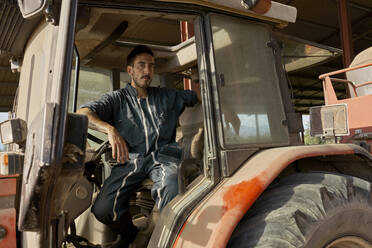 Farmer sitting in tractor - VEGF02862
