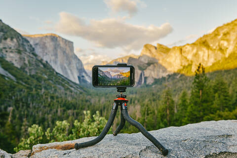 Phone taking picture of Yosemite National Park in northern California. stock photo