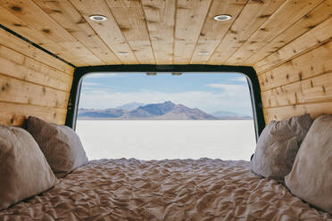 View of the Bonneville Salt Flats from bed of camper van. - CAVF88743