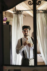 Groom getting ready for wedding at dressing room - ALBF01487