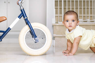 Cute baby crawling on floor at home - JCMF01371