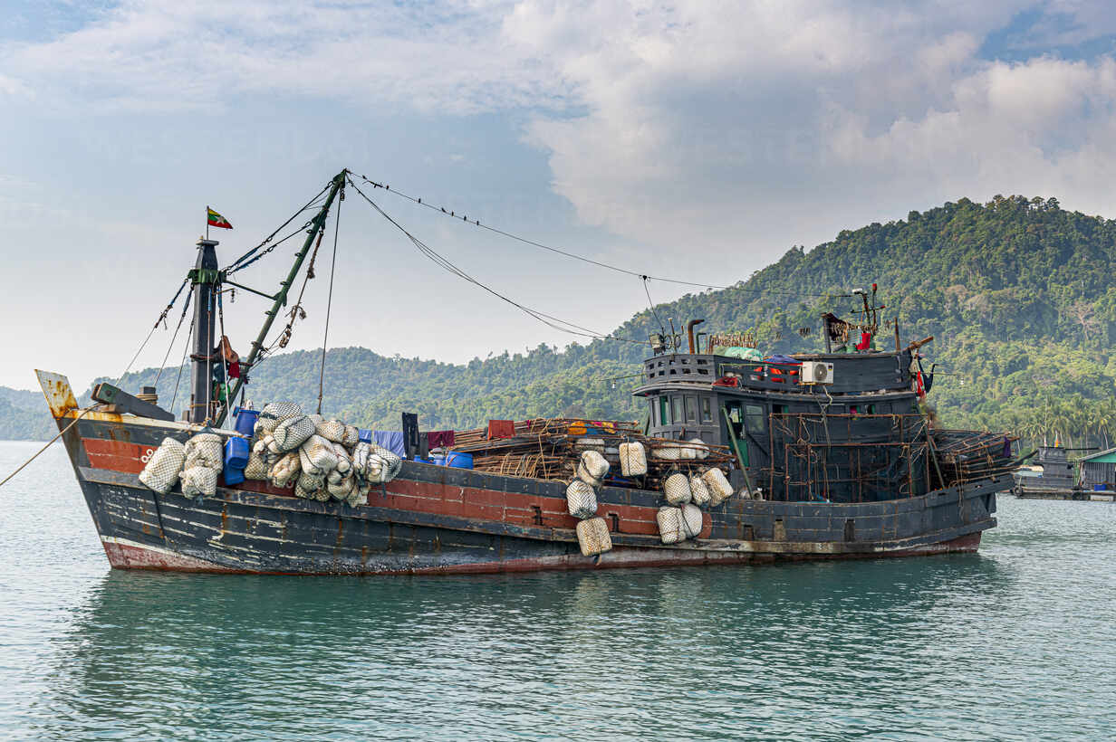 Myanmar, Tanintharyi Region, Old fishing boat moored in Mergui Archipelago  stock photo