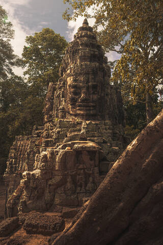 Facade of amazing religious monument of Buddha located in Angkor Wat complex on sunny day in Cambodia stock photo