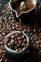 Coffee in coffee pot and coffee beans on the table - ADSF15641