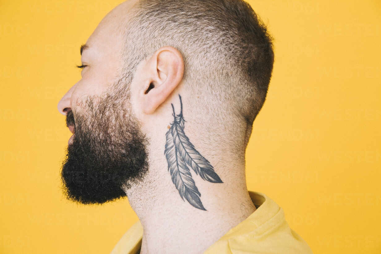 versatile tattoos - Feather tattoo on neck by #versatiletattoos | Facebook