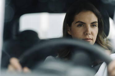 Young woman driving car - KNSF08521