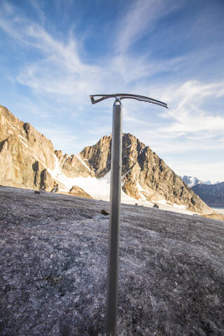 Mountaineering ice axe in glacier, Baffin Island stock photo