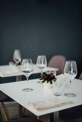 Glasses on the table in an empty restaurant - CAVF89073