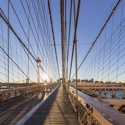 USA, New York, New York City, Brooklyn Bridge at sunrise - AHF00017