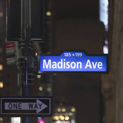 USA, New York, New York City, Madison Avenue sign at night - AHF00036