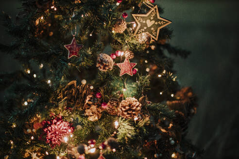 Close-up of illuminated Christmas tree at night - GMLF00612