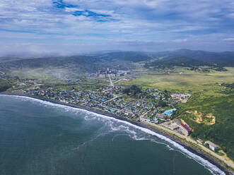 Russia, Primorsky Krai, Zarubino, Aerial view of town on shore of Sea of Japan - KNTF05318