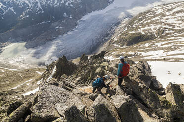 Climbers descend towards Rhone Glacier, Valais, Switzerland - CAVF89181